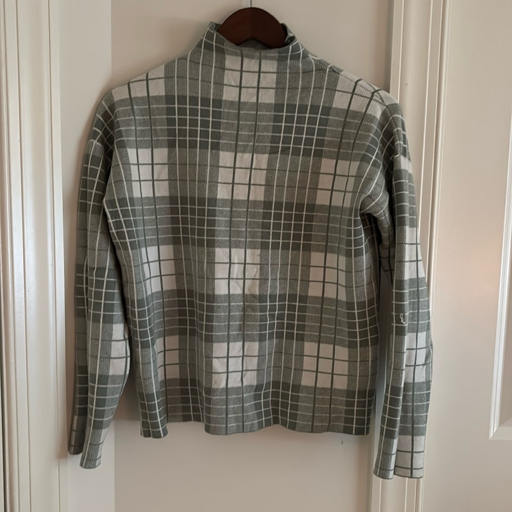 Green and white checkered turtleneck sweater